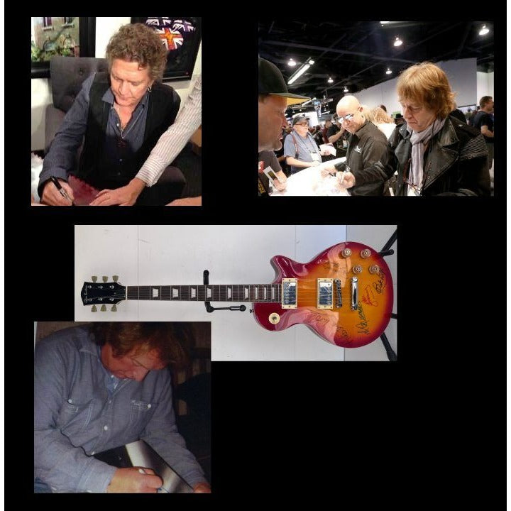 Lou Gramm, Dennis Elliott, Al Greenwood, Ian McDonald, Mick Jones, and Rick Wills vintage Les Paul full size electric guitar signed.