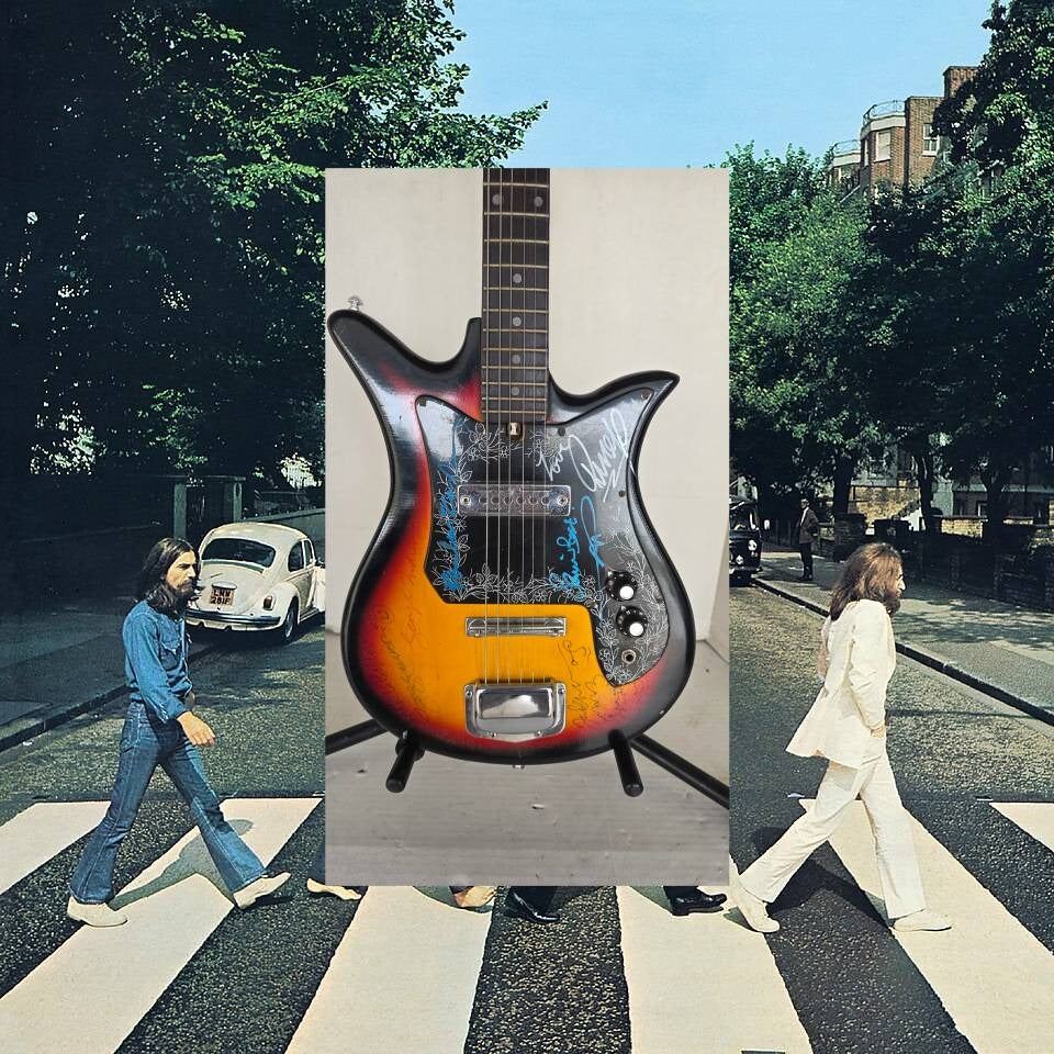The Beatles John Lennon Paul McCartney George Harrison Sir George Martin Ringo Starr & Pete Best one of a kind vintage guitar signed.