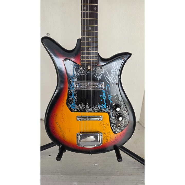 The Beatles John Lennon Paul McCartney George Harrison Sir George Martin Ringo Starr & Pete Best one of a kind vintage guitar signed.