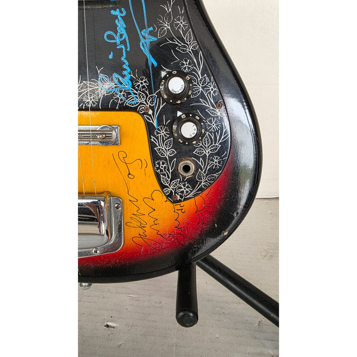 The Beatles John Lennon Paul McCartney George Harrison Sir George Martin Ringo Starr & Pete Best one of a kind vintage guitar signed.