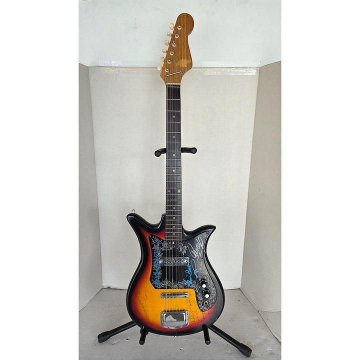 The Beatles John Lennon Paul McCartney George Harrison Sir George Martin Ringo Starr & Pete Best one of a kind vintage guitar signed.