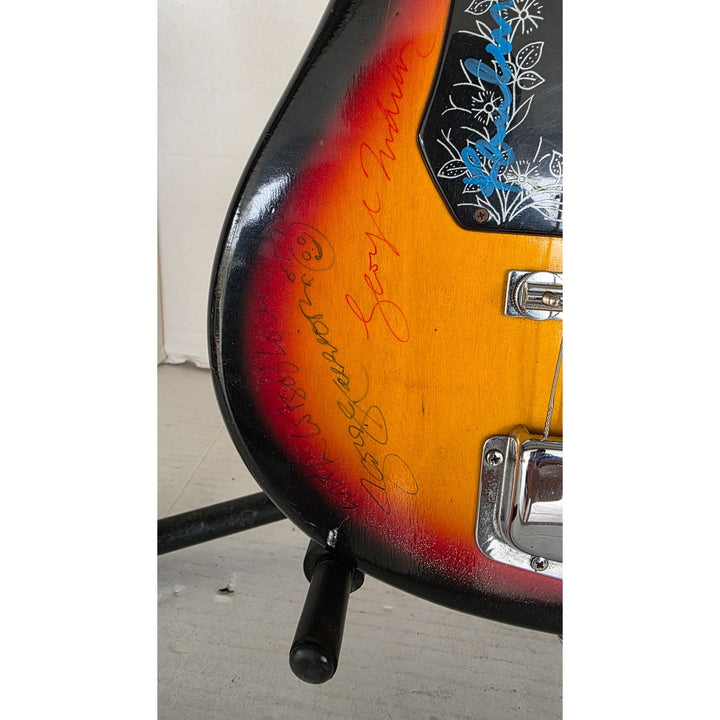 The Beatles John Lennon Paul McCartney George Harrison Sir George Martin Ringo Starr & Pete Best one of a kind vintage guitar signed.