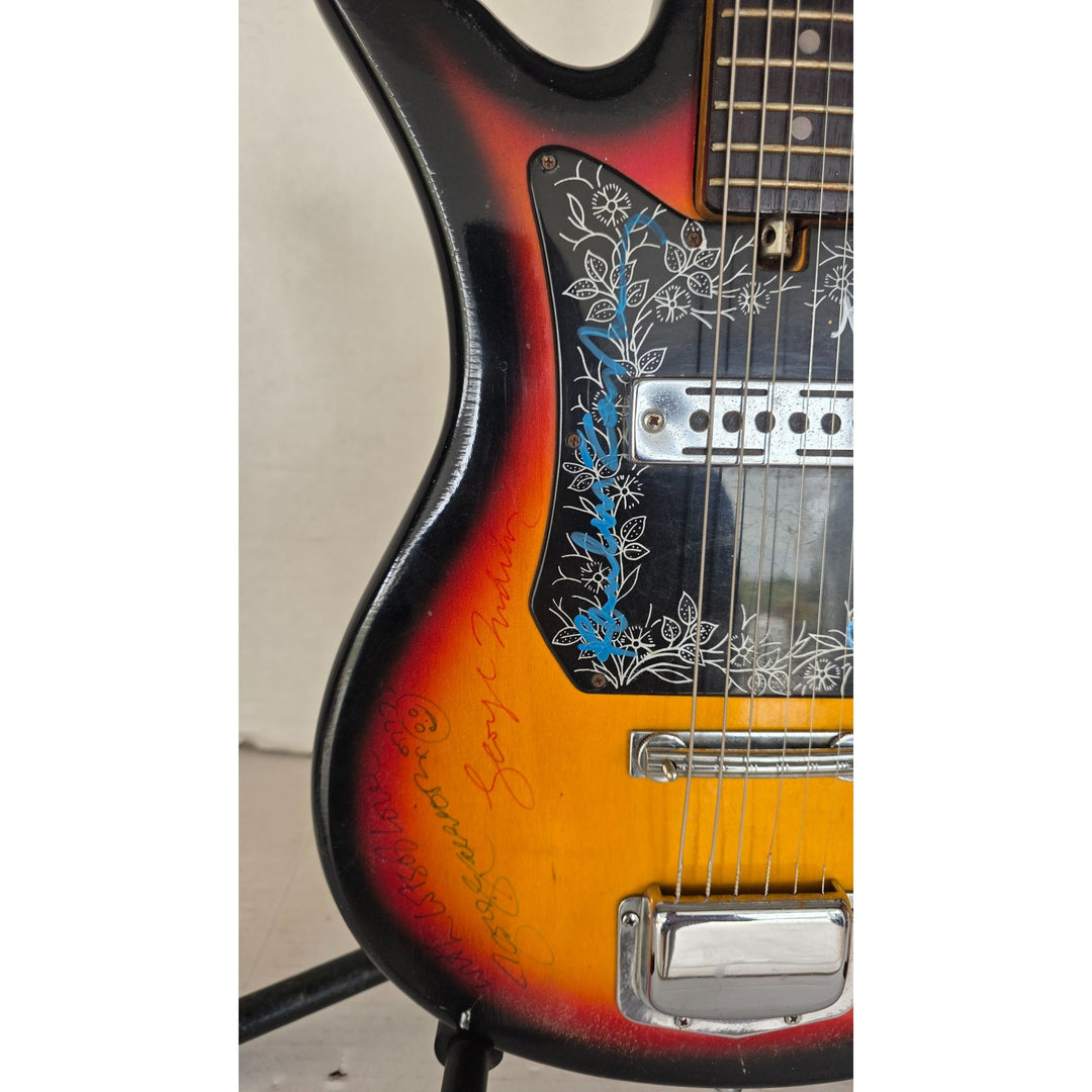 The Beatles John Lennon Paul McCartney George Harrison Sir George Martin Ringo Starr & Pete Best one of a kind vintage guitar signed.