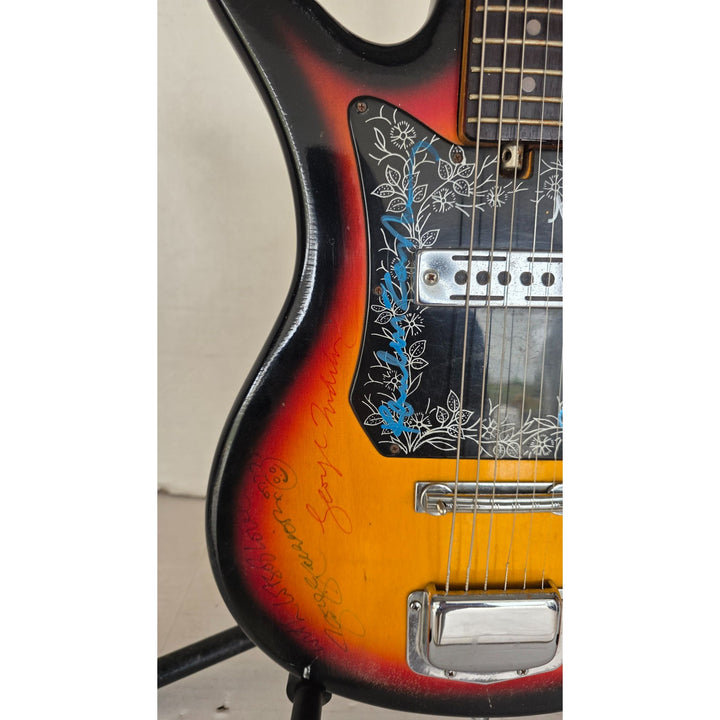The Beatles John Lennon Paul McCartney George Harrison Sir George Martin Ringo Starr & Pete Best one of a kind vintage guitar signed.