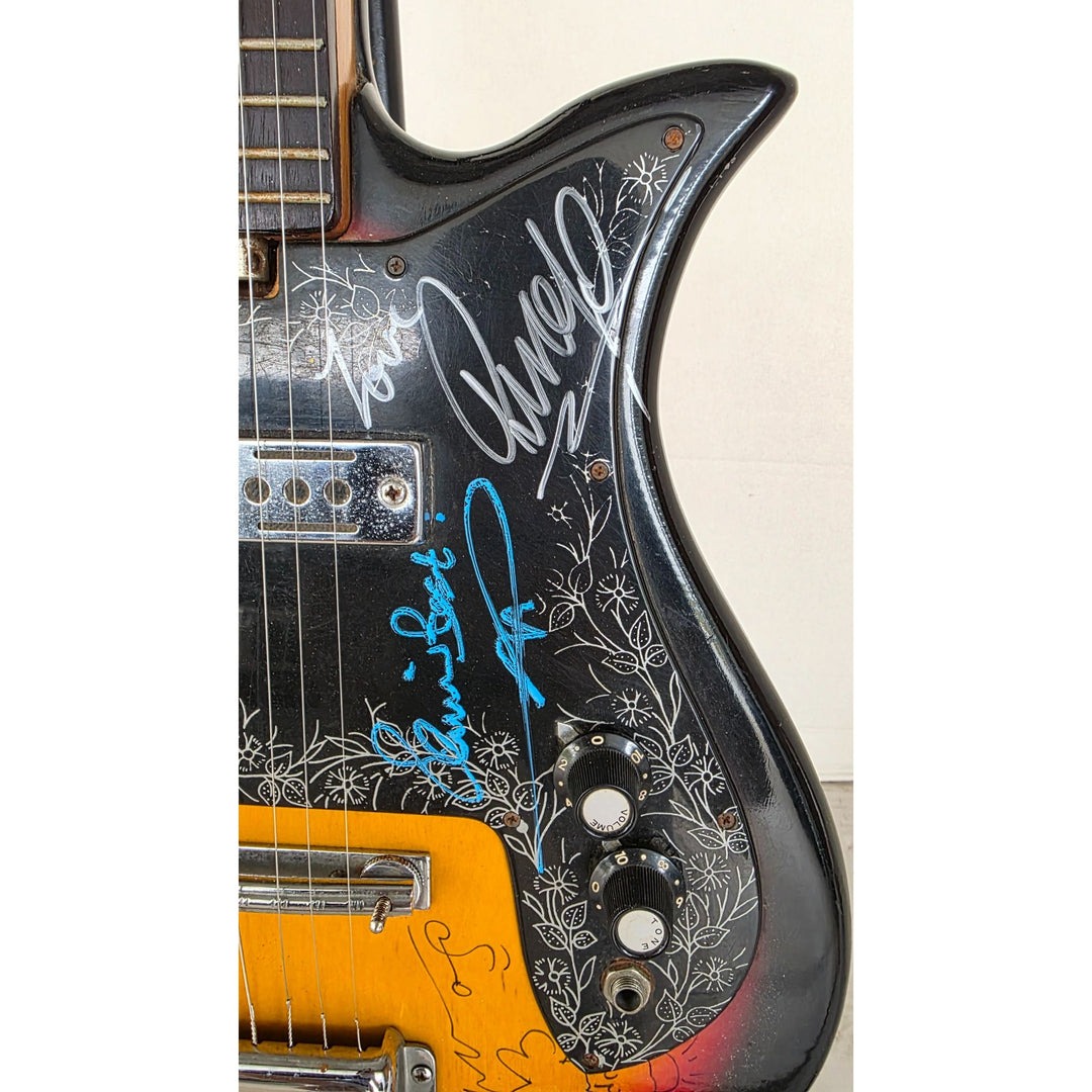 The Beatles John Lennon Paul McCartney George Harrison Sir George Martin Ringo Starr & Pete Best one of a kind vintage guitar signed.