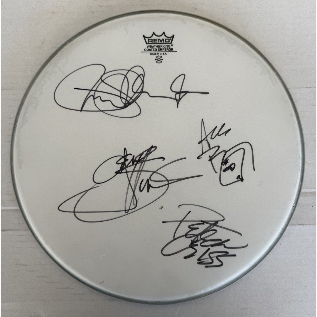 Kiss, Gene Simmons, Paul Stanley, Peter Chris, Ace Frehley one-of-a-kind drumhead signed with proof.