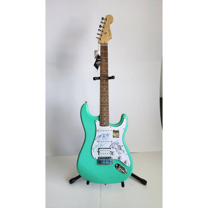 Cream Eric Clapton, Ginger Baker, Jack Bruce Fender Stratocaster electric guitar signed with proof