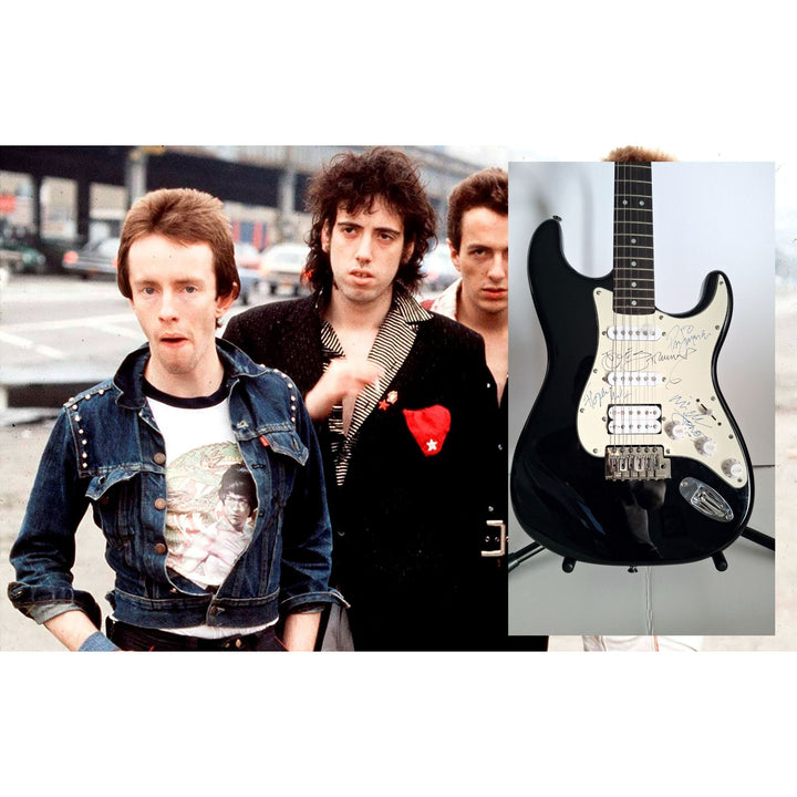 Mick Jones, Joe Strummer, Topper Headon, & Paul Simonon, The Clash Fender Stratocaster electric guitar signed with proof