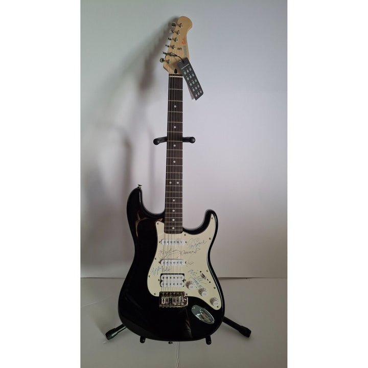 Mick Jones, Joe Strummer, Topper Headon, & Paul Simonon, The Clash Fender Stratocaster electric guitar signed with proof