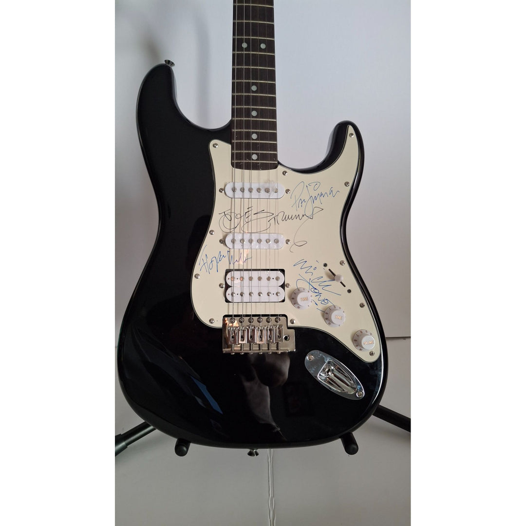 Mick Jones, Joe Strummer, Topper Headon, & Paul Simonon, The Clash Fender Stratocaster electric guitar signed with proof