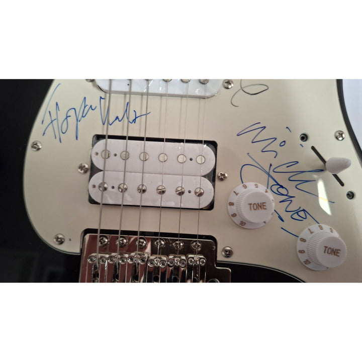 Mick Jones, Joe Strummer, Topper Headon, & Paul Simonon, The Clash Fender Stratocaster electric guitar signed with proof