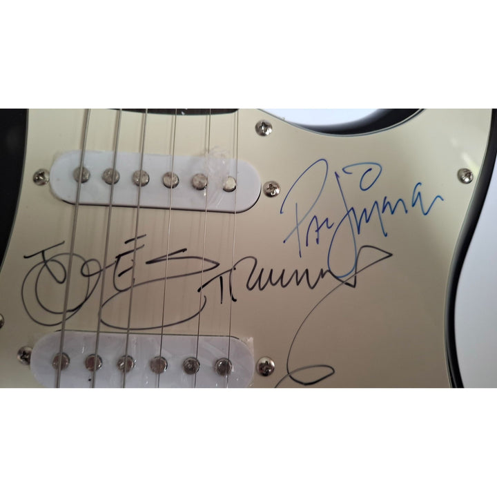 Mick Jones, Joe Strummer, Topper Headon, & Paul Simonon, The Clash Fender Stratocaster electric guitar signed with proof