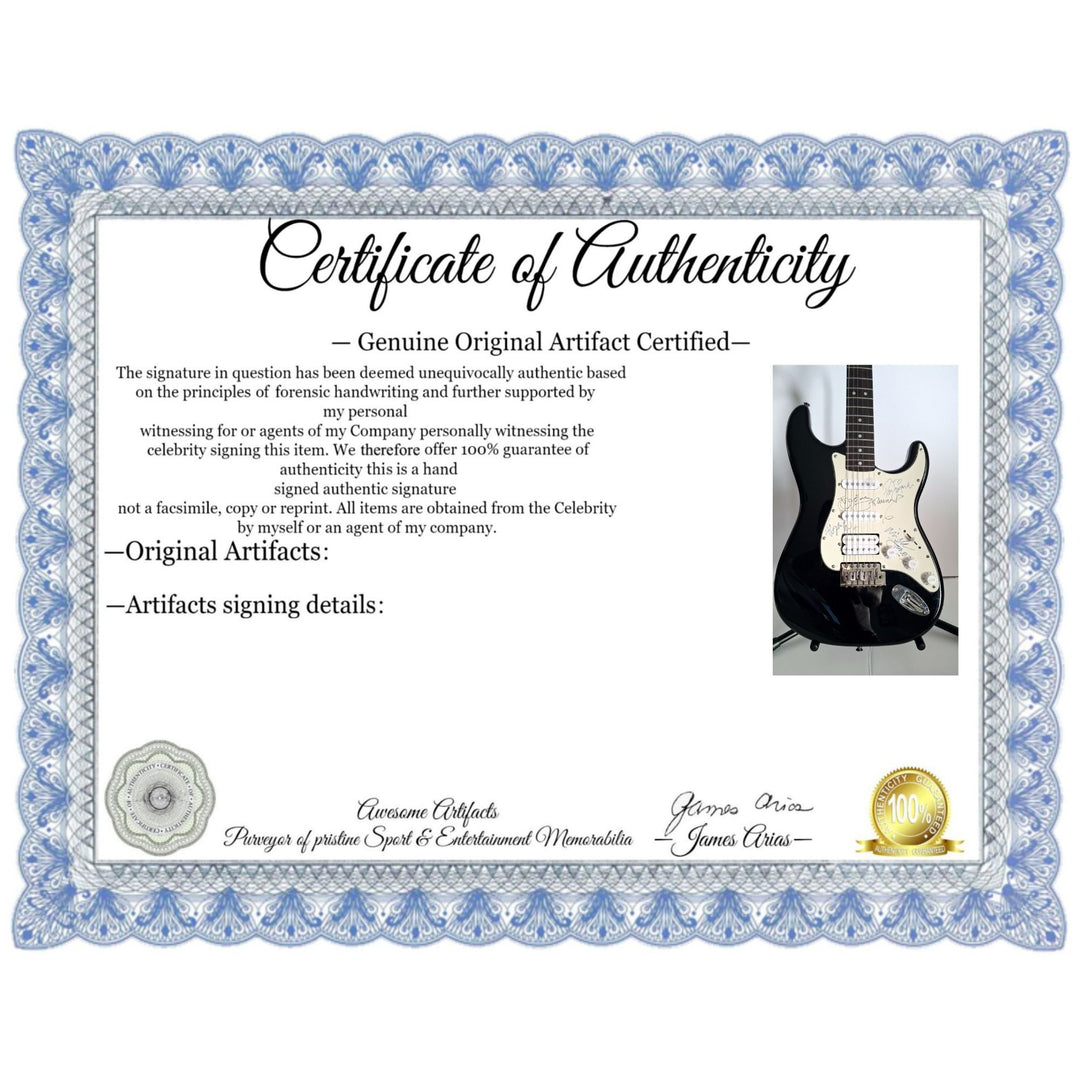 Mick Jones, Joe Strummer, Topper Headon, & Paul Simonon, The Clash Fender Stratocaster electric guitar signed with proof