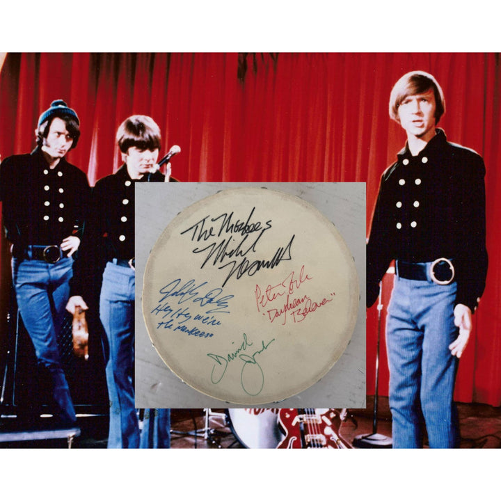 The Monkees signed with inscriptions Michael Nesmith, Davey Jones Mickey Dolenz Peter York Tambourine 8" signed with proof.