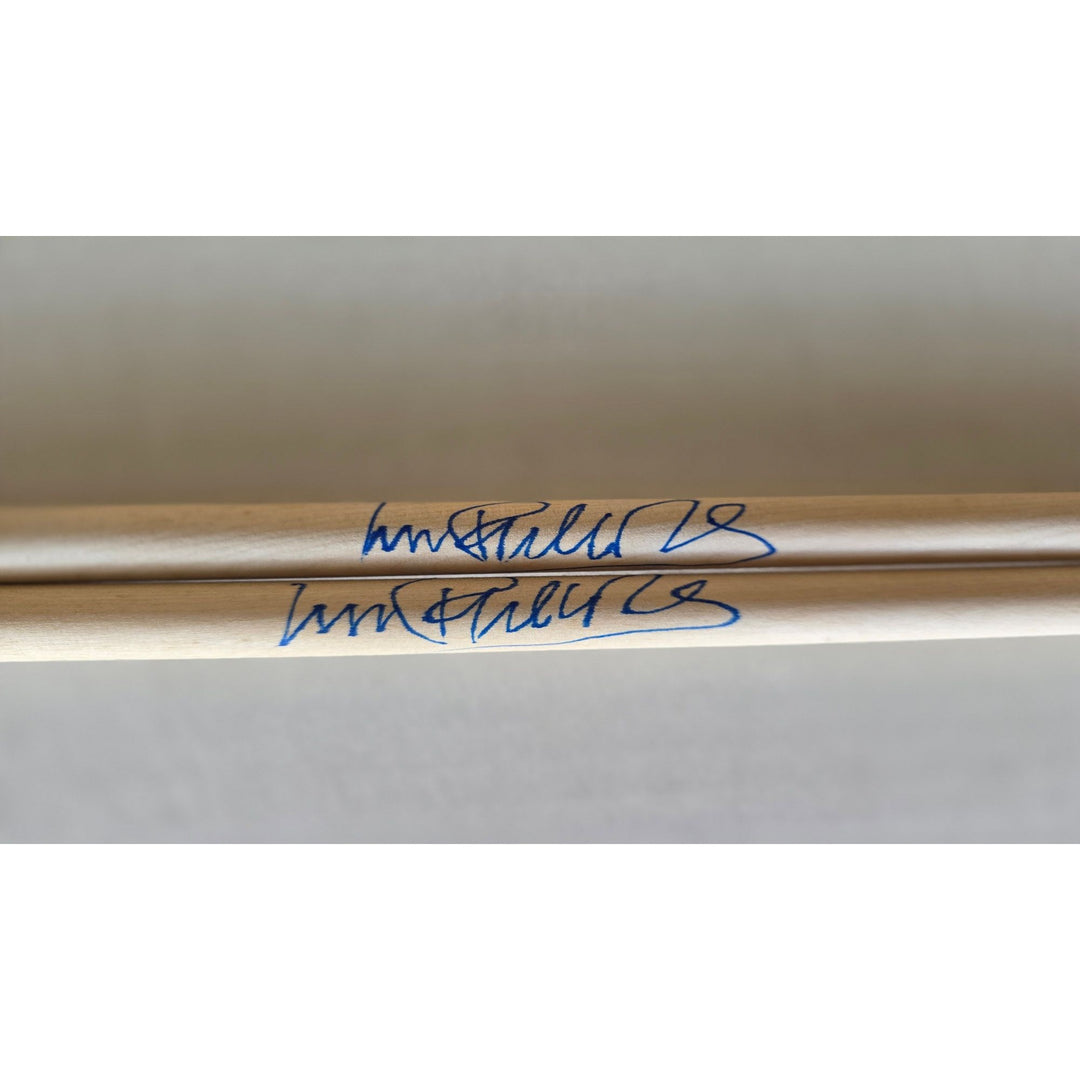 Phil Collins legendary drummer Genesis pair of drumsticks signed with proof.