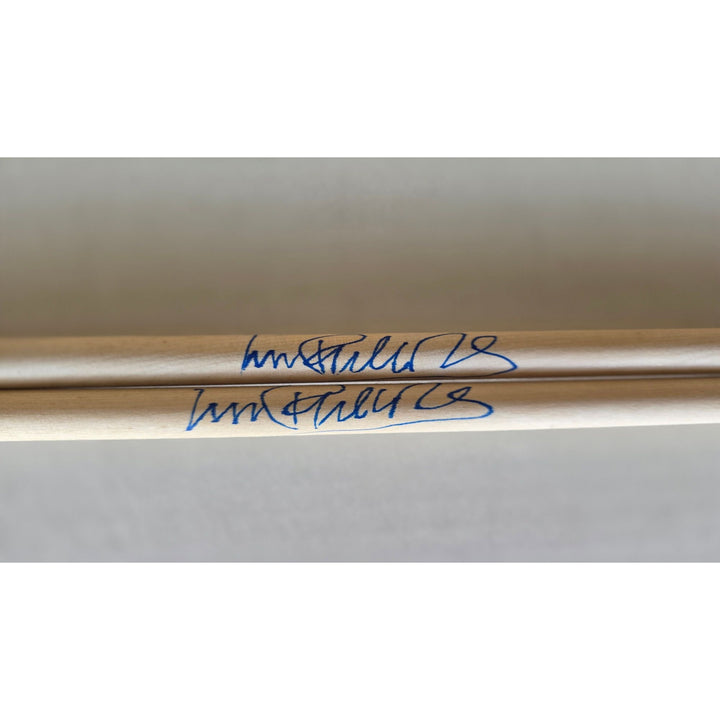 Phil Collins legendary drummer Genesis pair of drumsticks signed with proof.