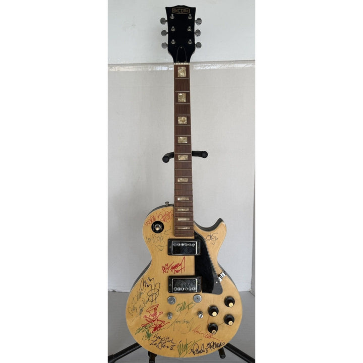 1970s Encore E49 Les Paul Custom 15 iconic guitarists signed with proof.