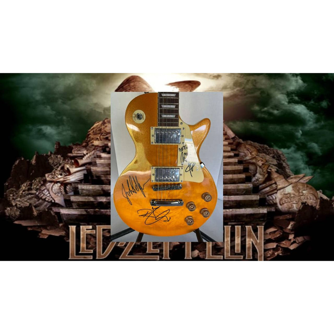 Led Zeppelin Jimmy Page, Robert Plant, John Paul Jones gold les paul electric guitar signed with proof.