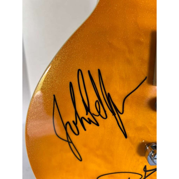Led Zeppelin Jimmy Page, Robert Plant, John Paul Jones gold les paul electric guitar signed with proof.