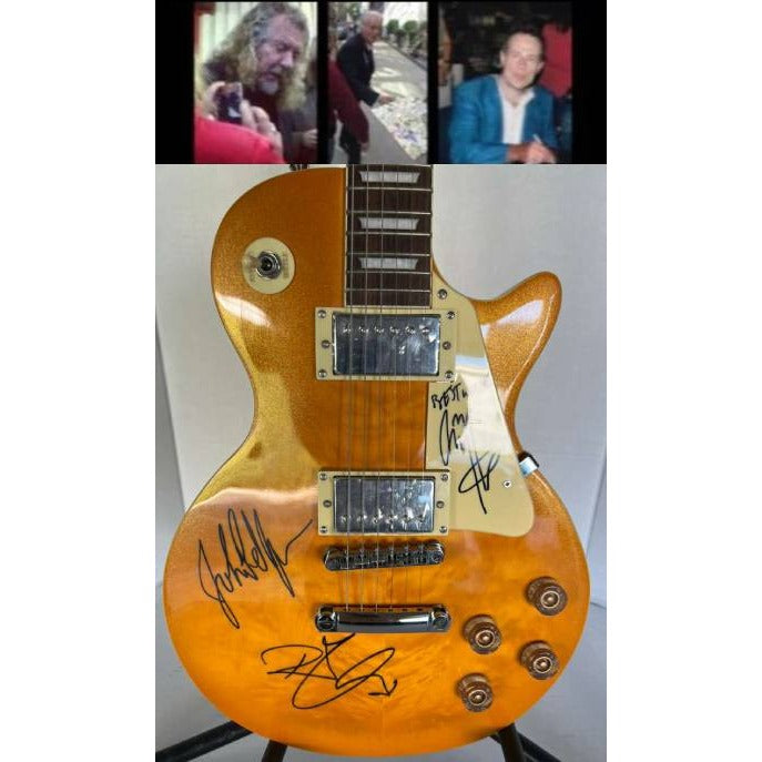 Led Zeppelin Jimmy Page, Robert Plant, John Paul Jones gold les paul electric guitar signed with proof.