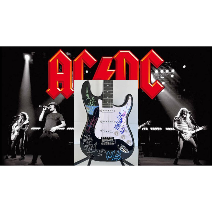 Angus Young & Malcolm Young Brian Johnston Cliff Williams Phil Rudd electric guitar signed with proof.
