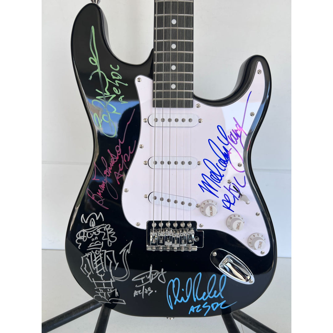 Angus Young & Malcolm Young Brian Johnston Cliff Williams Phil Rudd electric guitar signed with proof.