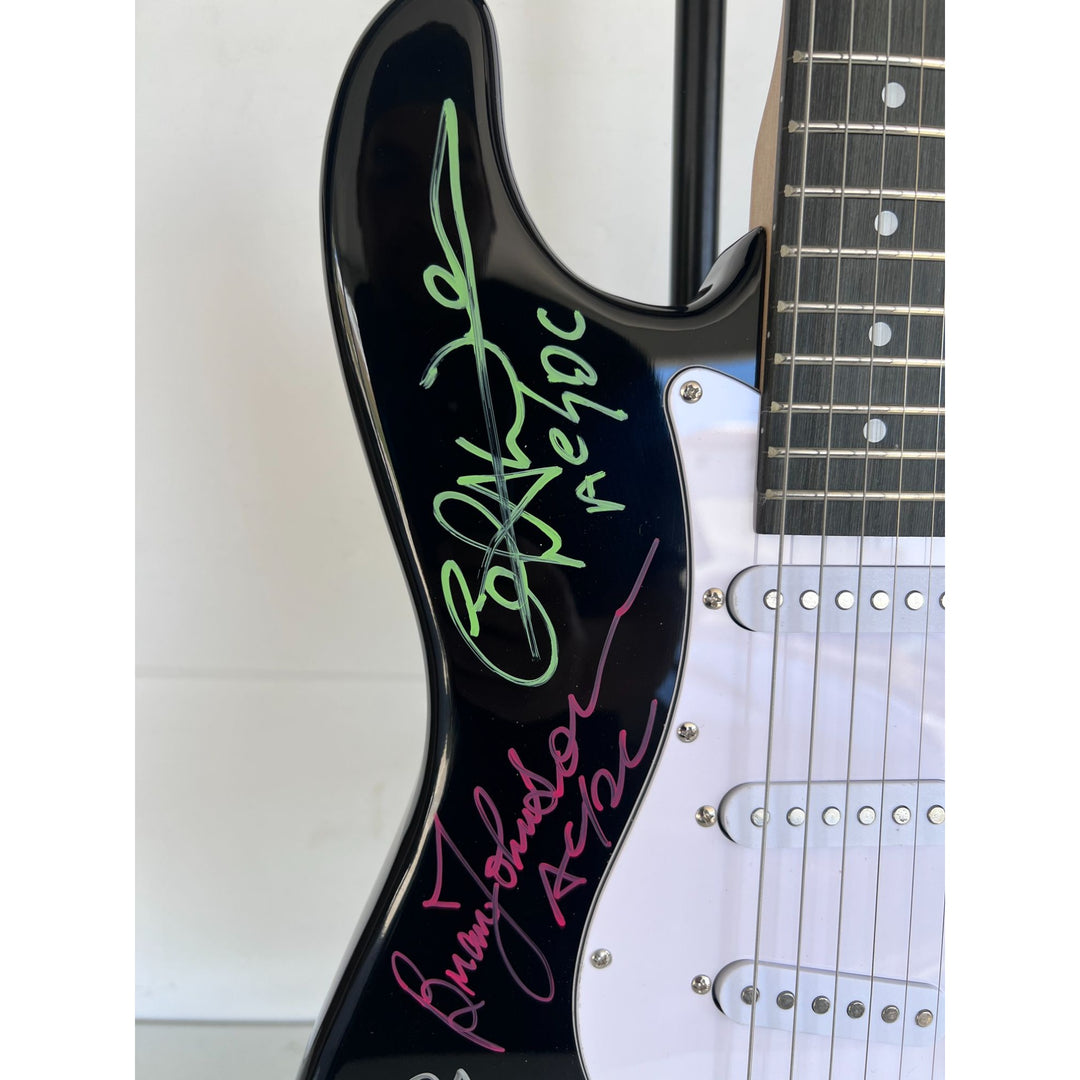 Angus Young & Malcolm Young Brian Johnston Cliff Williams Phil Rudd electric guitar signed with proof.