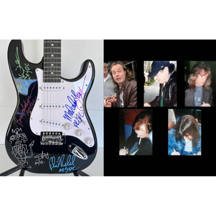 Angus Young & Malcolm Young Brian Johnston Cliff Williams Phil Rudd electric guitar signed with proof.