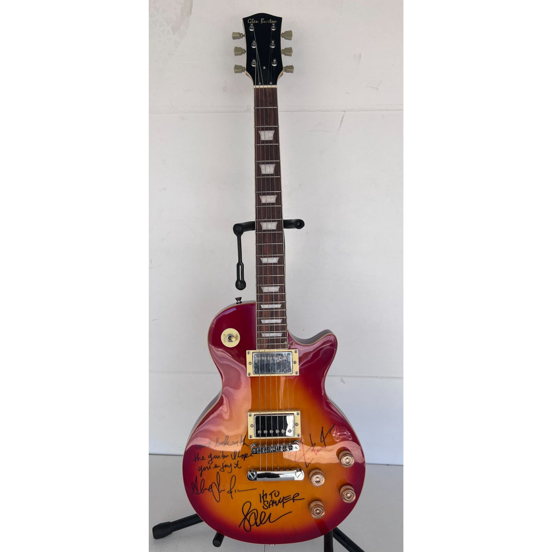 Rush one of a kind Geddy Lee Neil Peart Alex Lifeson vintage cherry les pail full size electric guitar signed and inscribed with proof.
