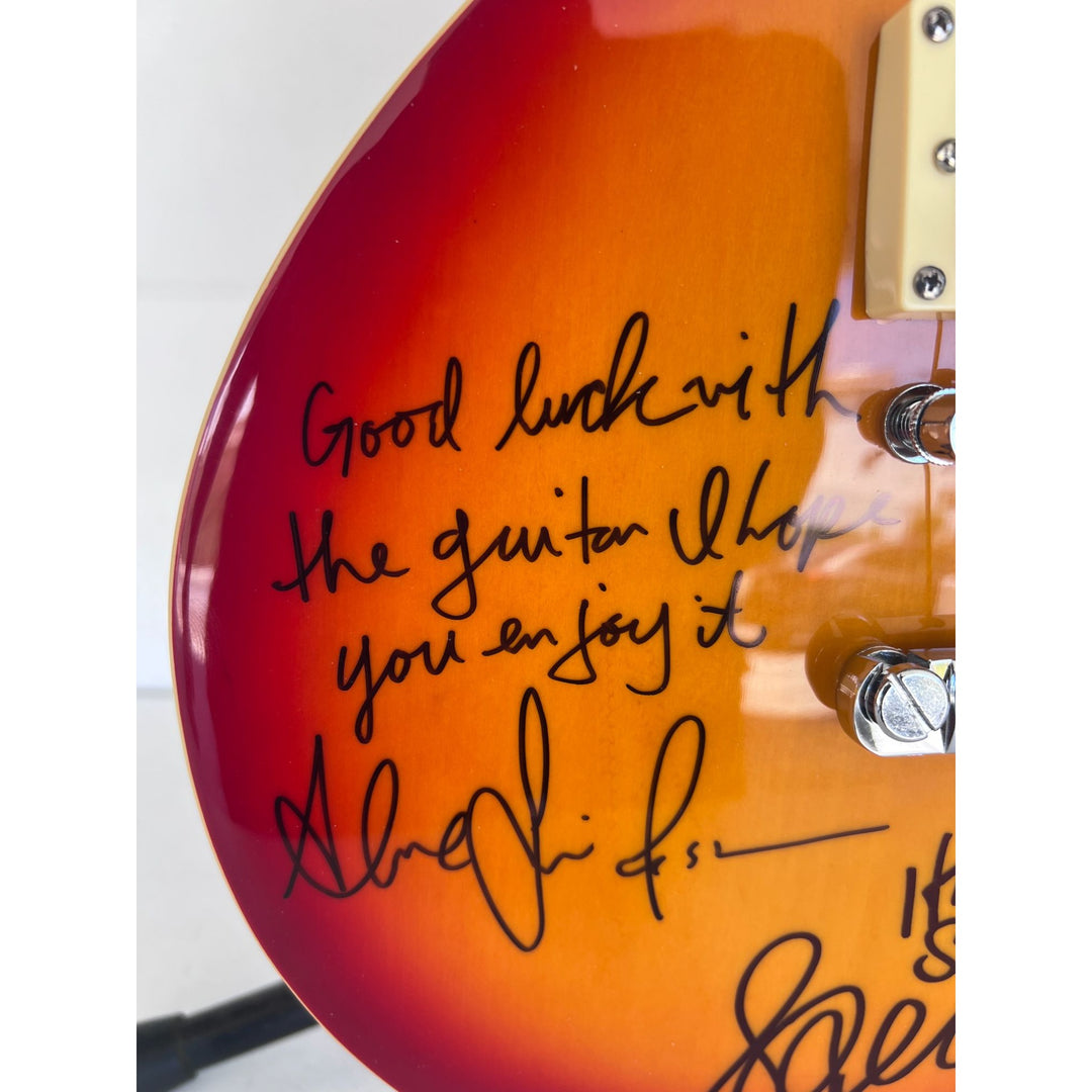 Rush one of a kind Geddy Lee Neil Peart Alex Lifeson vintage cherry les pail full size electric guitar signed and inscribed with proof.