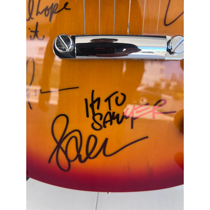 Rush one of a kind Geddy Lee Neil Peart Alex Lifeson vintage cherry les pail full size electric guitar signed and inscribed with proof.