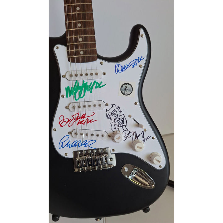 Angus & Malcolm Young, Brian Johnston, Phil Rudd, Cliff Williams AC/DC Fender Stratocaster electric guitar signed with proof