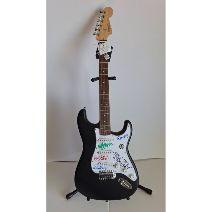 Angus & Malcolm Young, Brian Johnston, Phil Rudd, Cliff Williams AC/DC Fender Stratocaster electric guitar signed with proof