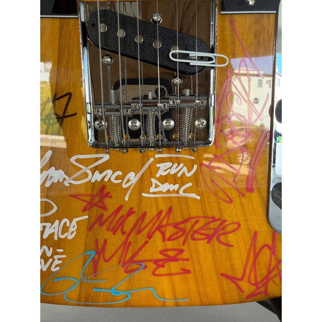 Beastie Boys,  Run DMC, RATM, Public Enemy  wood telecaster  electric guitar signed with proof.