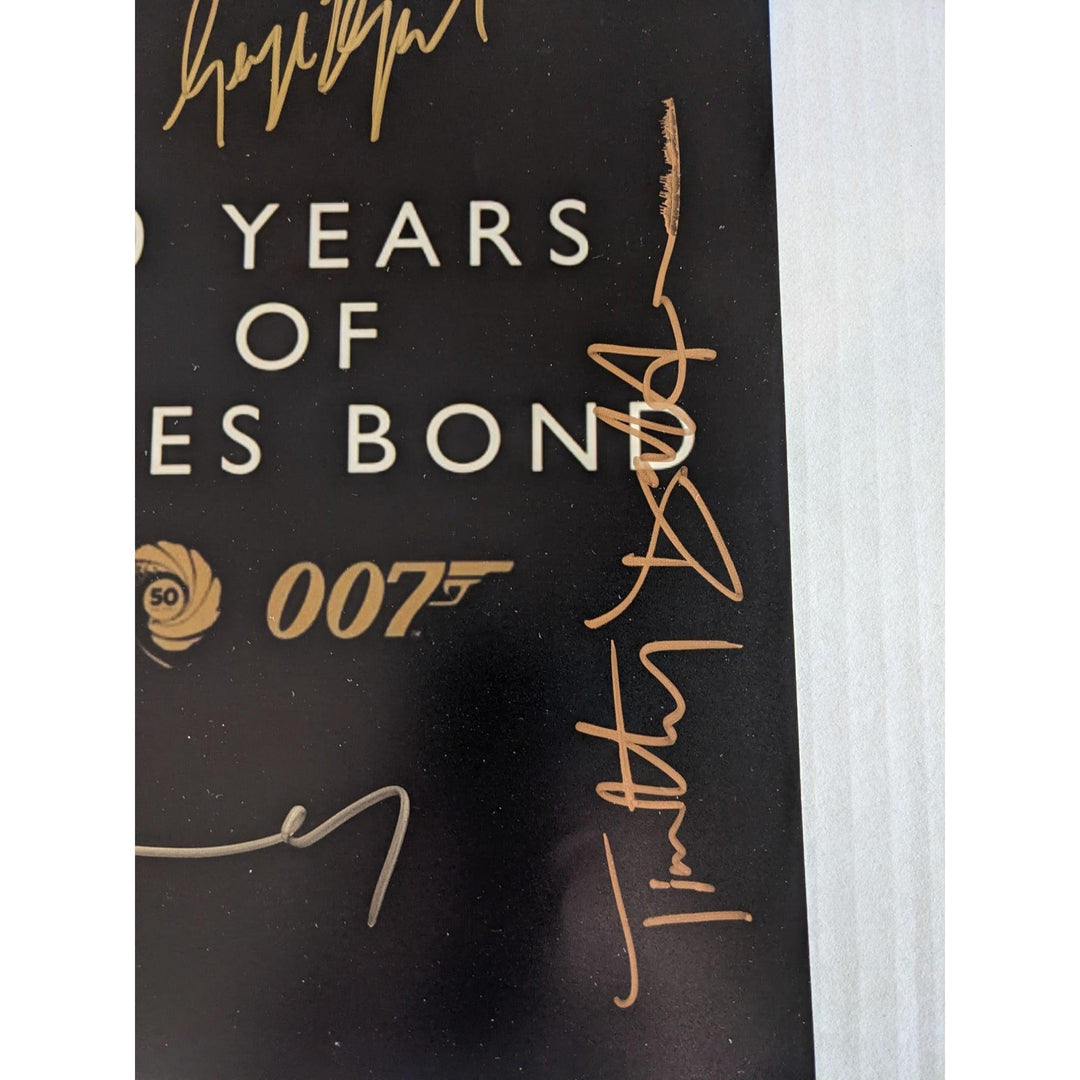 James Bond 007, Sean Connery, Roger Moore, Daniel Craig, Pierce Brosnan, Timothy Dalton, George Lazenby 11x14 photo signed with proof