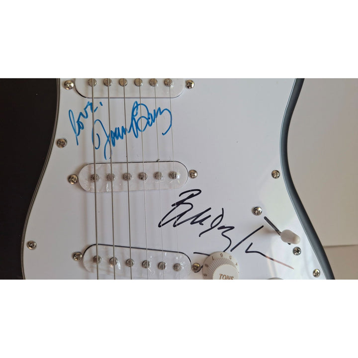 Joan Baez & Bob Dylan, authentic Fender Stratocaster electric guitar signed with proof