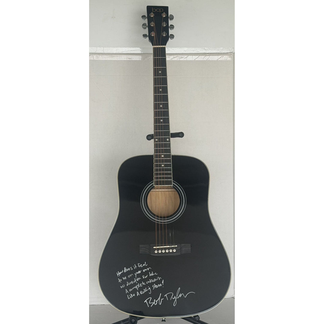 Bob Dylan black acoustic guitar signed with lyrics and signing proof.