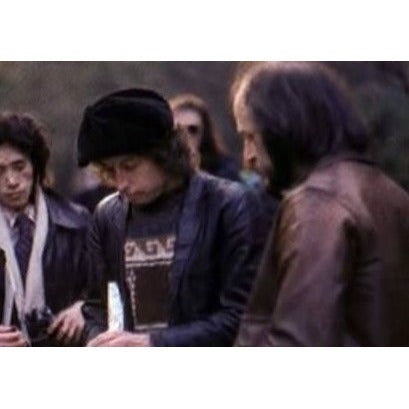 Bob Dylan black acoustic guitar signed with lyrics and signing proof.