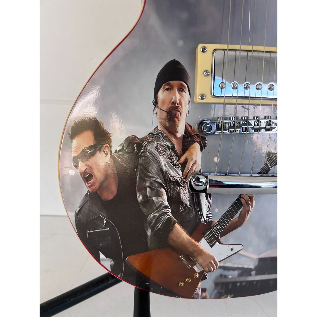 U2 Paul Hewson " Bono" and "the Edge" David Howell Evans   one of a kind les paul (full size) electric guitar signed with proof.