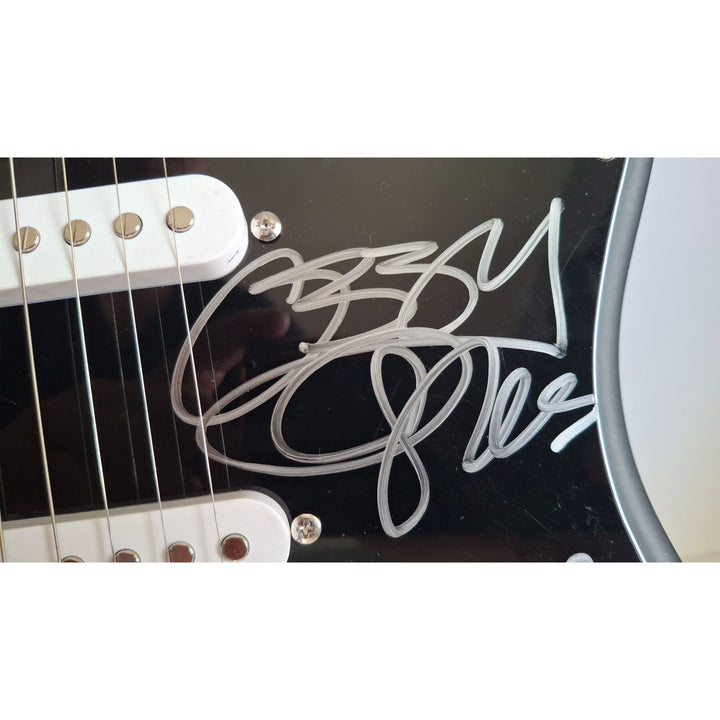 Black Sabbath, Ozzy Osbourne, signed with inscription for Ronnie James Dio, Fender Stratocaster electric guitar signed with proof