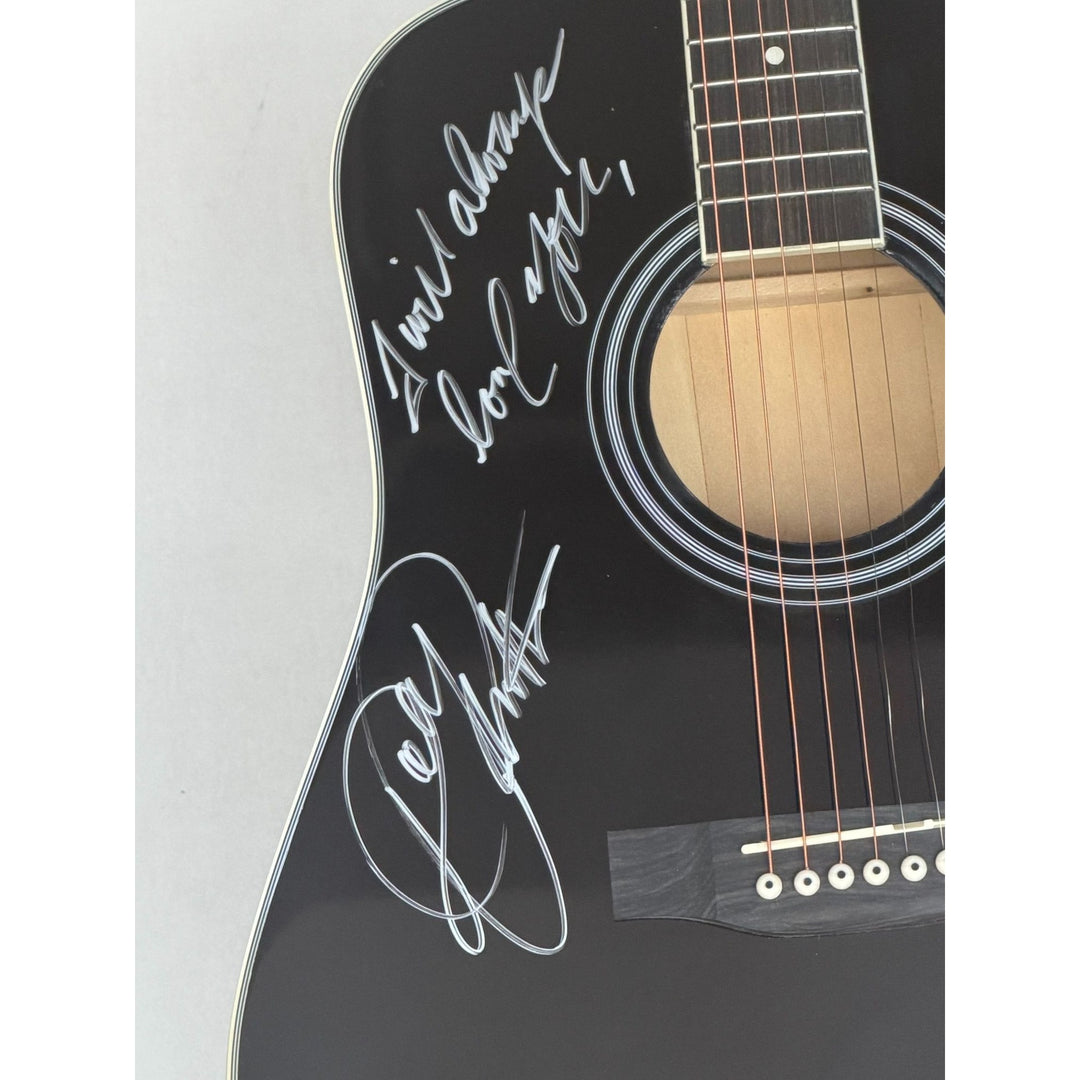 Dolly Parton full size black acoustic guitar signed with proof.