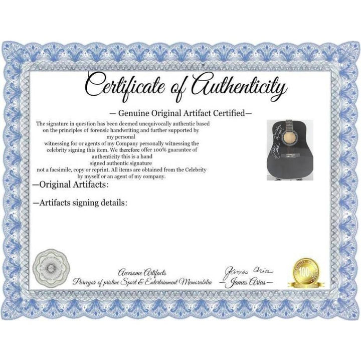 Dolly Parton full size black acoustic guitar signed with proof.