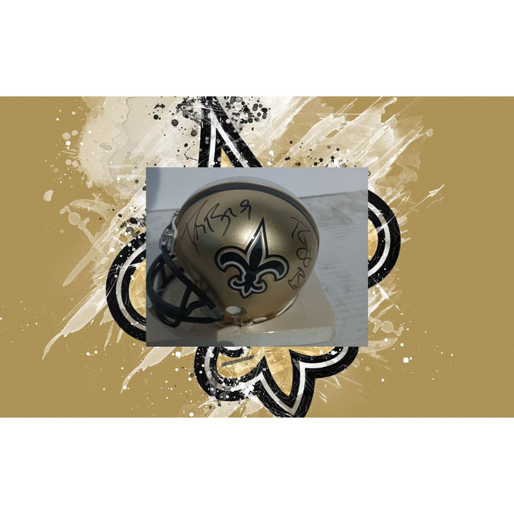 New Orleans Saints Drew Brees and Reggie Bush Riddell mini helmet signed with proof