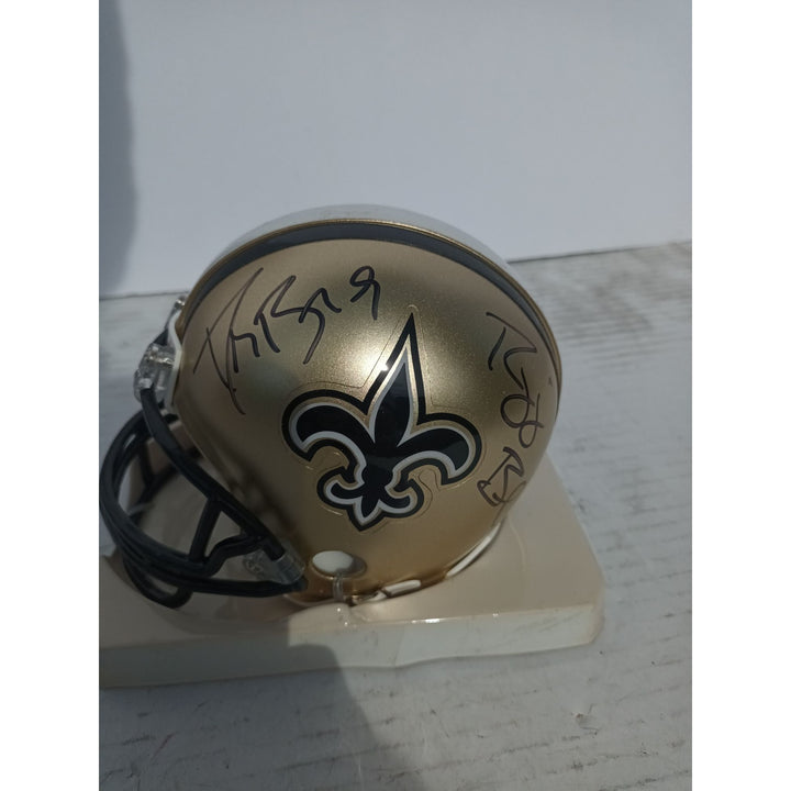 New Orleans Saints Drew Brees and Reggie Bush Riddell mini helmet signed with proof