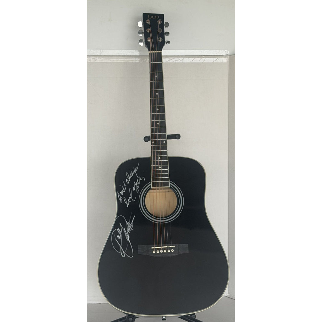 Dolly Parton full size black acoustic guitar signed with proof.