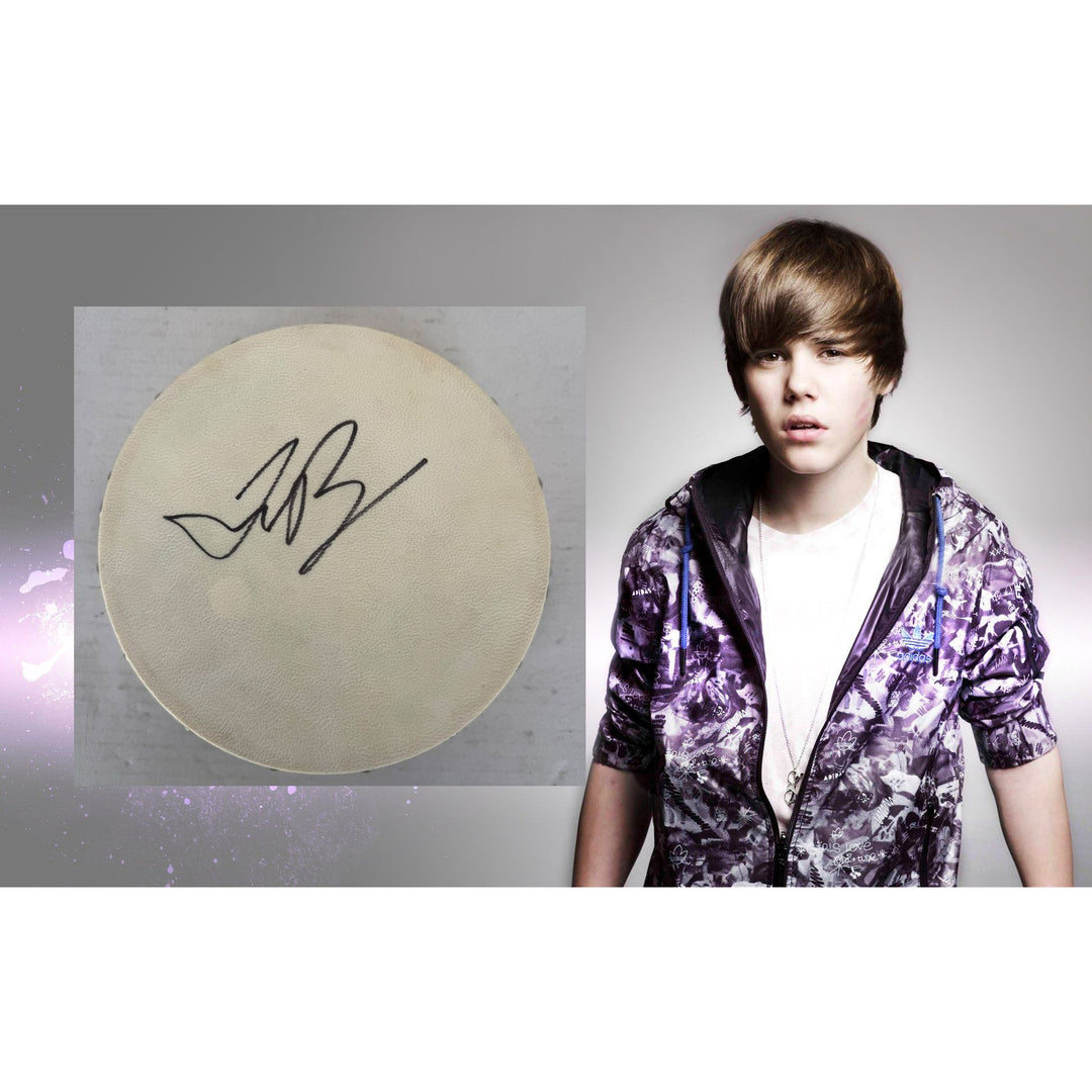 Justin Bieber Tambourine 8" signed with proof.
