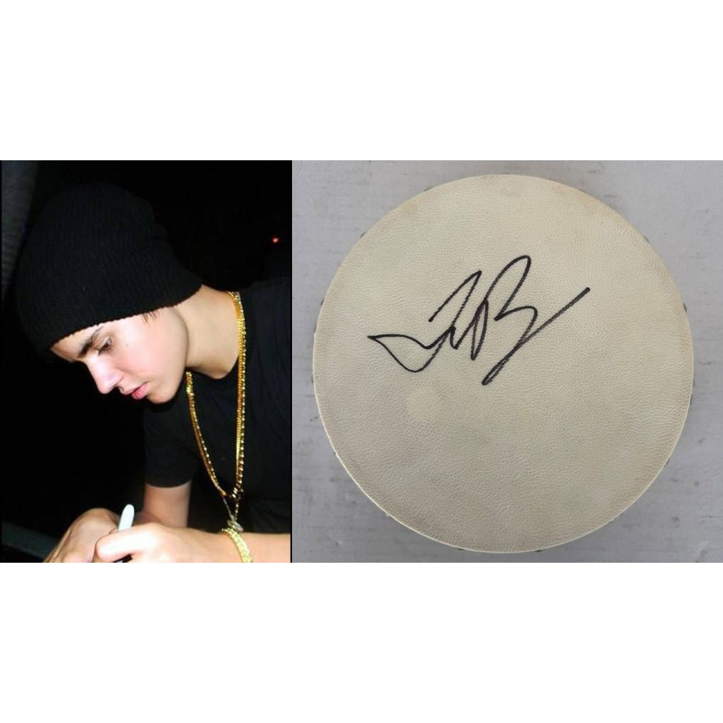 Justin Bieber Tambourine 8" signed with proof.