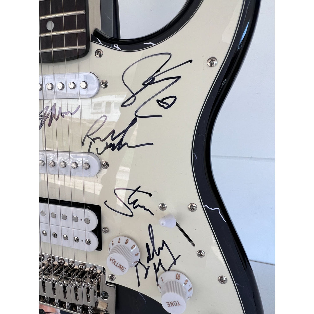 Steve Walsh, Robby Steinhardt, Dave Hope, Kerry Livgren, Rich Williams, Phil Ehart Kansas band signed electric guitar with proof.