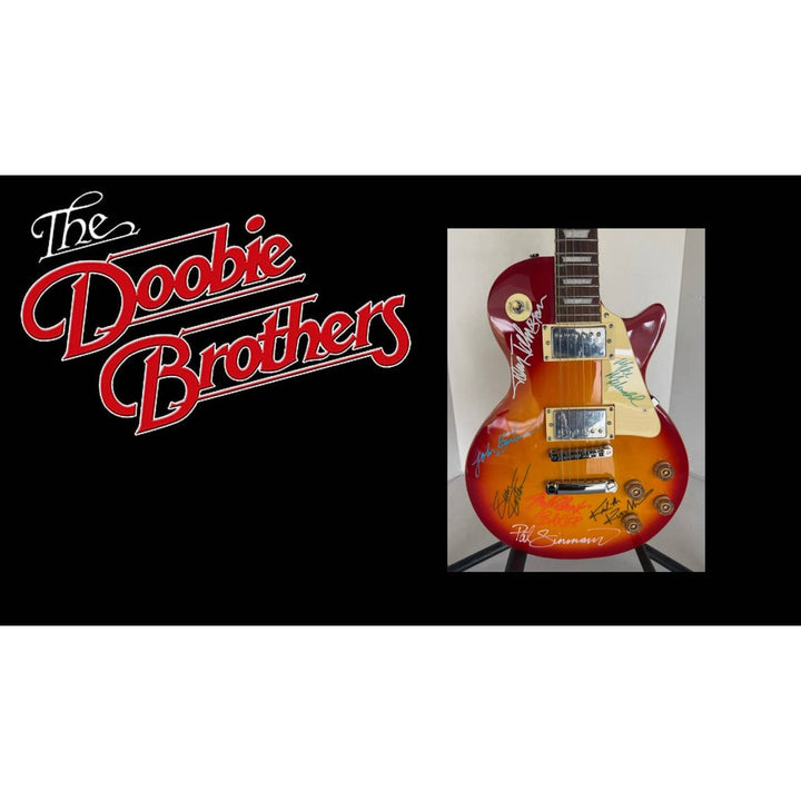 The Doobie Brothers Michael McDonald, Patrick Simmons, John McFee, Tom Johnston vintage Cherry Les Paul electric guitar signed with proof.