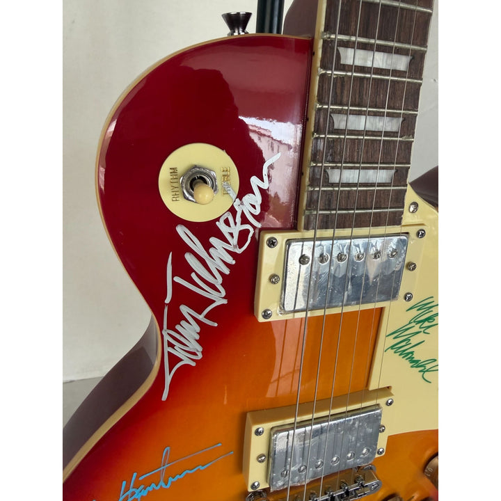 The Doobie Brothers Michael McDonald, Patrick Simmons, John McFee, Tom Johnston vintage Cherry Les Paul electric guitar signed with proof.